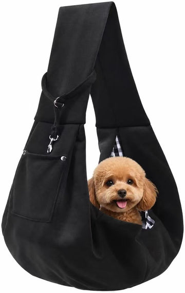 Black puppy sling dog carrier with a small dog sitting inside