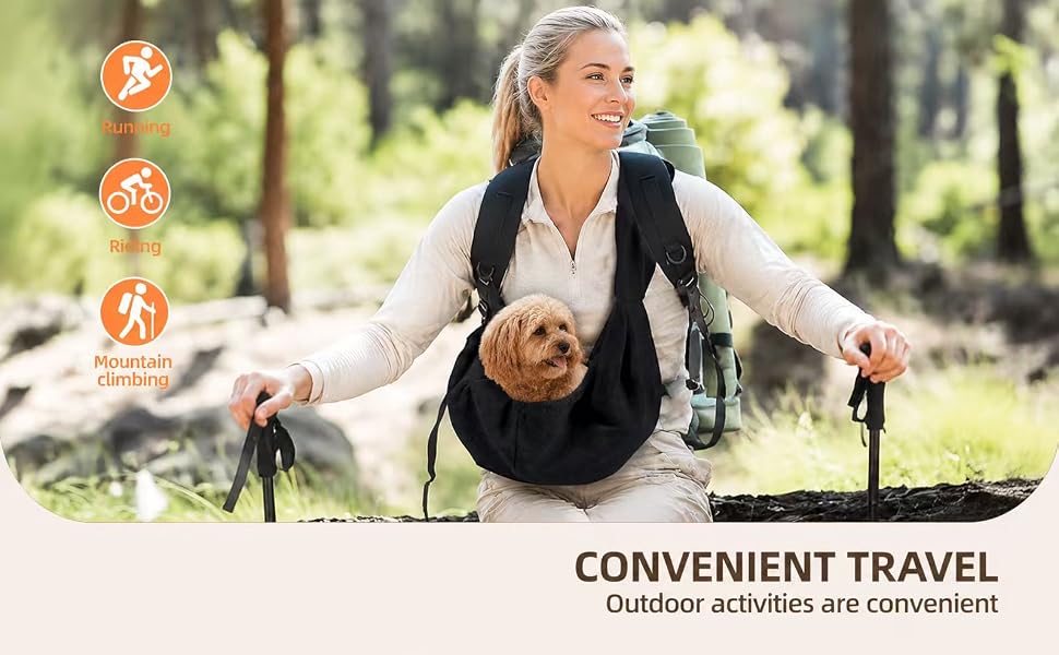 Woman hiking with a small dog carried in a pet sling